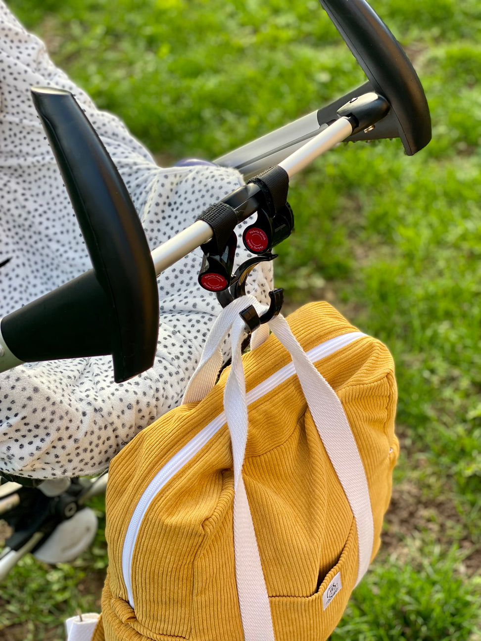 Attache sac à langer